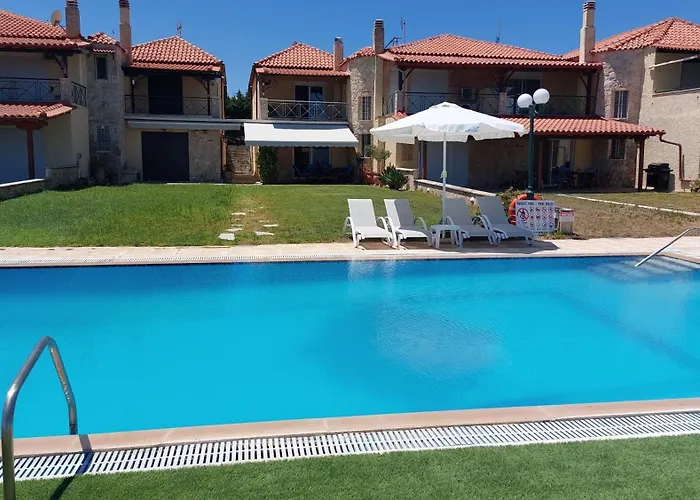 Blue Pastel-Cliffside Villa, Shared Pool, Wild Sandy Beach Nearby